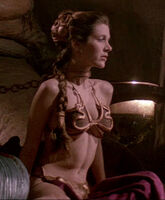 Carrie Fisher as slave Leia tightening her abs