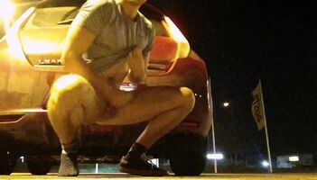 Huge cumshot fully nude in a parking lot